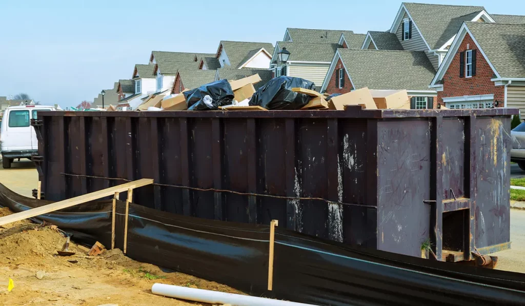filled dumpster in residential neighborhood